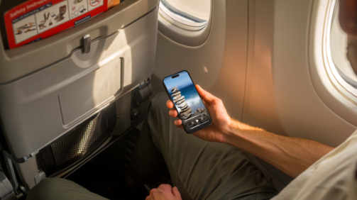 Mockuuups Free iPhone 14 Pro on a Plane Mockup