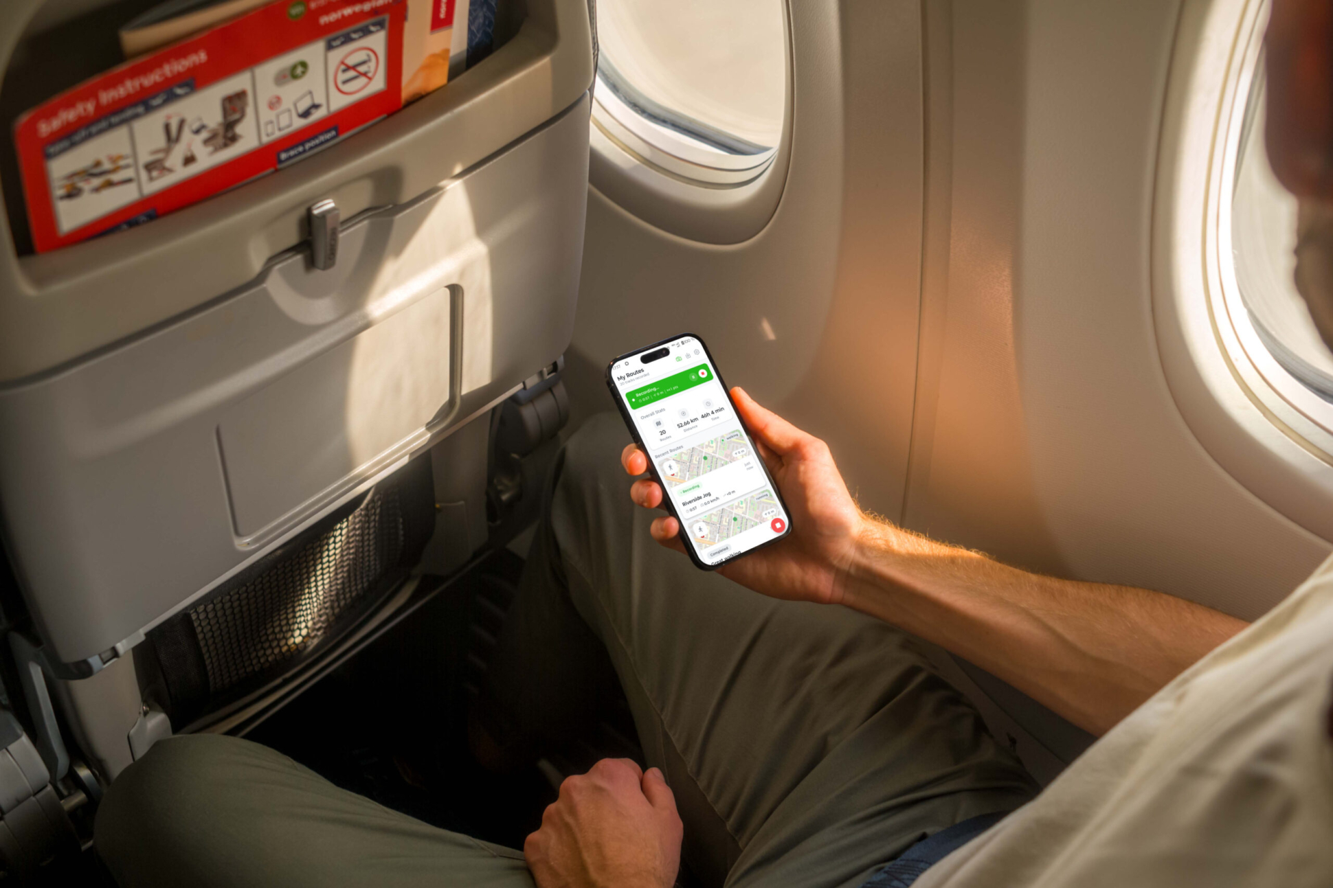 Mockuuups Free iPhone 14 Pro on a Plane Mockup