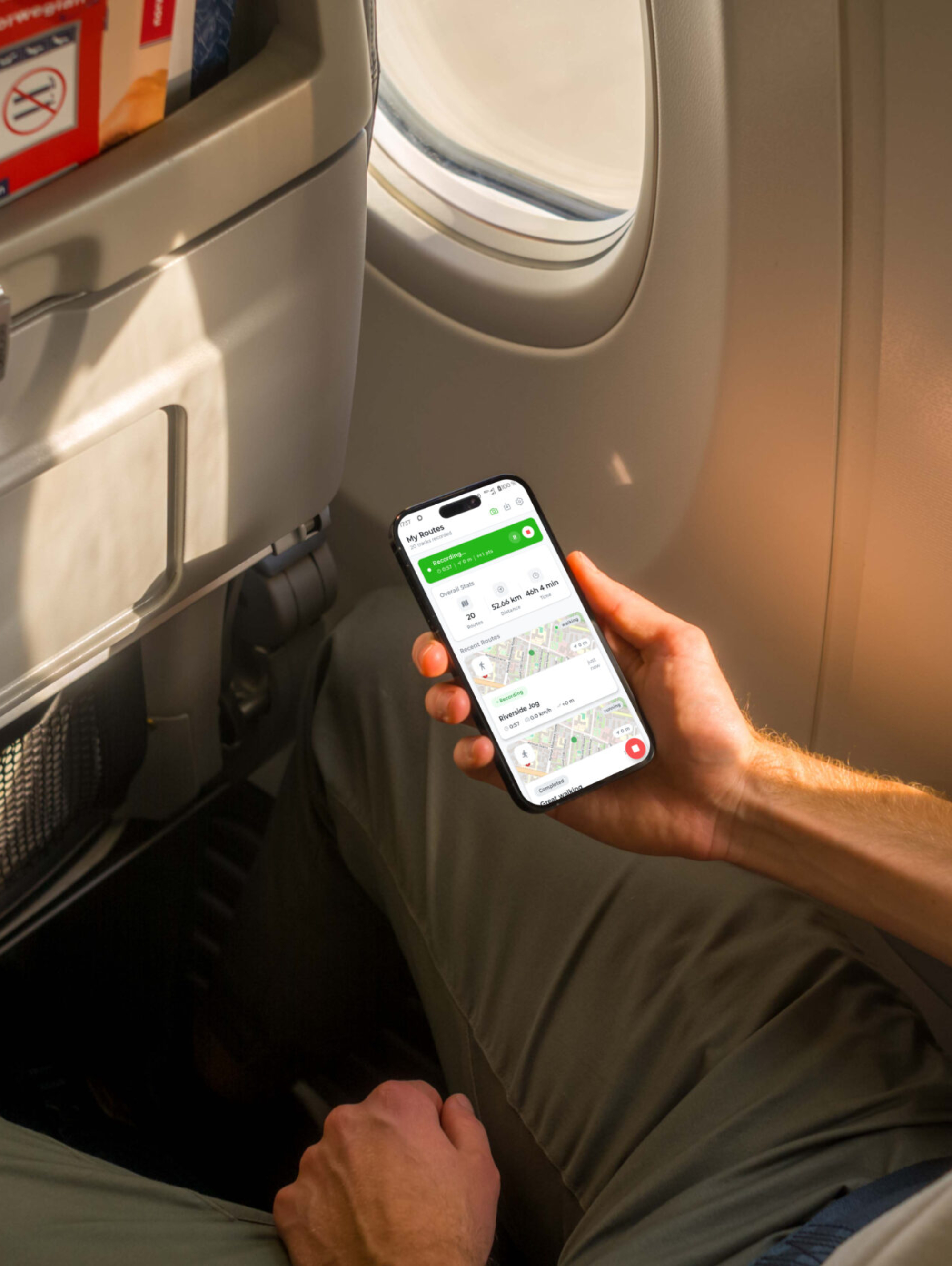Mockuuups Free iPhone 14 Pro on a Plane Mockup