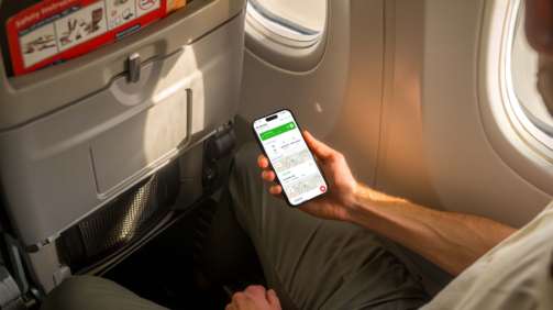 Mockuuups Free iPhone 14 Pro on a Plane Mockup